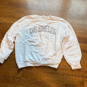 This is a super cute sweater that is white and black!